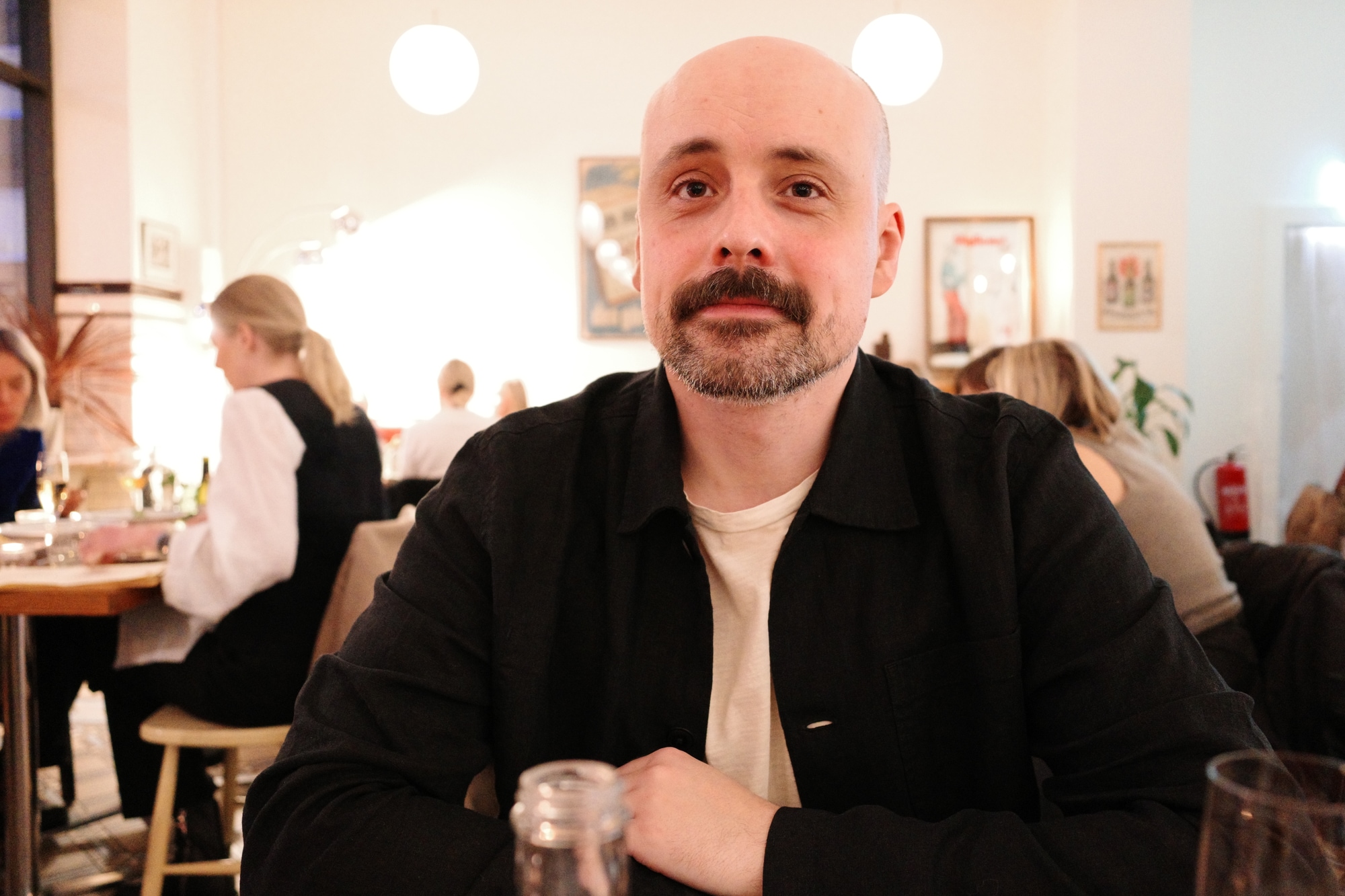 Rafael Fyen sitting at a restaurant table